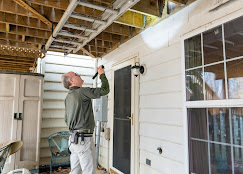 Bob Murphy inspecting the structural details of a residential porch